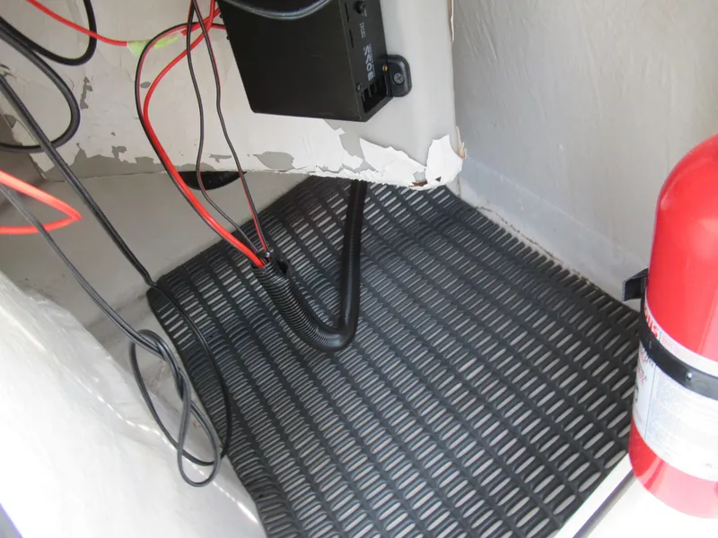 Slide: The Image of 2007 Tahoe Q8i boat interior wiring and fire extinguisher. - 19