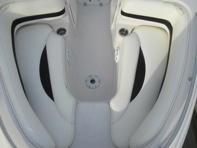 Slide: The Image of 2007 Tahoe Q8i boat interior seating area with white upholstery. - 22