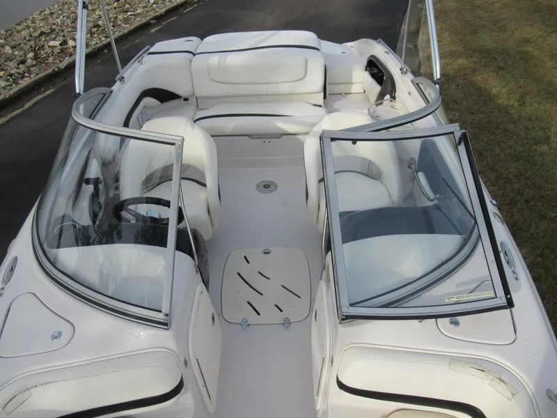 Slide: The Image of 2007 Tahoe Q8i boat interior with white seating and open windshield. - 23