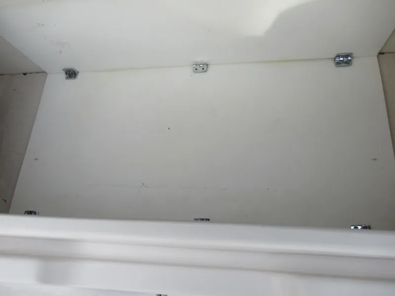 Slide: The Image of Empty storage compartment in a 2007 Tahoe Q8i boat. - 27