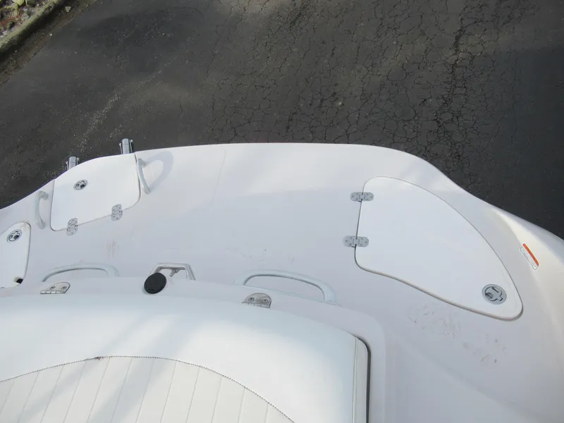 Slide: The Image of 2007 Tahoe Q8i boat deck with storage compartments and seating. - 28
