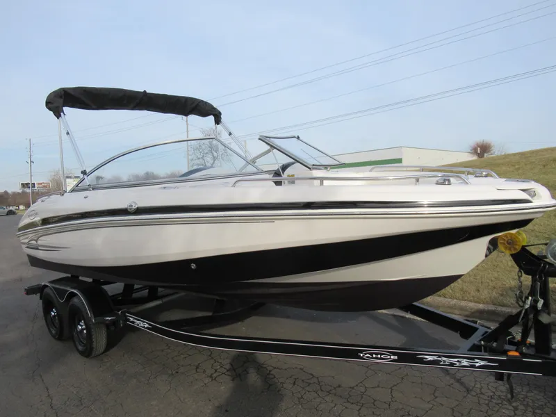 Slide: The Image of 2007 Tahoe Q8i boat on trailer with black and white design. - 5