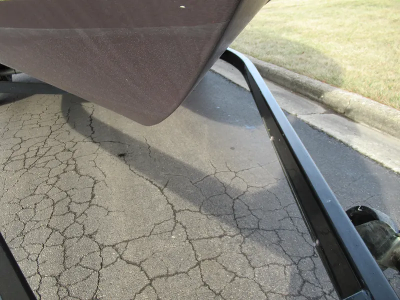 Slide: The Image of 2007 Tahoe Q8i boat on a trailer with cracked pavement background. - 7
