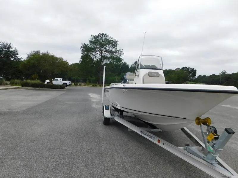 Slide: The Image of 2023 Key West 189 FS boat on a trailer in a parking lot. - 2