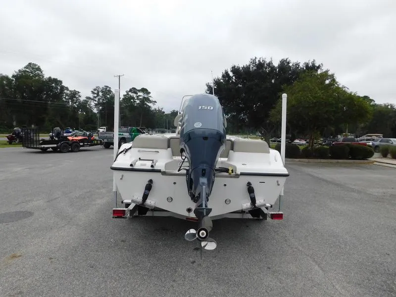 Slide: The Image of 2023 Key West 189 FS boat, rear view with outboard motor, parked on a trailer. - 6