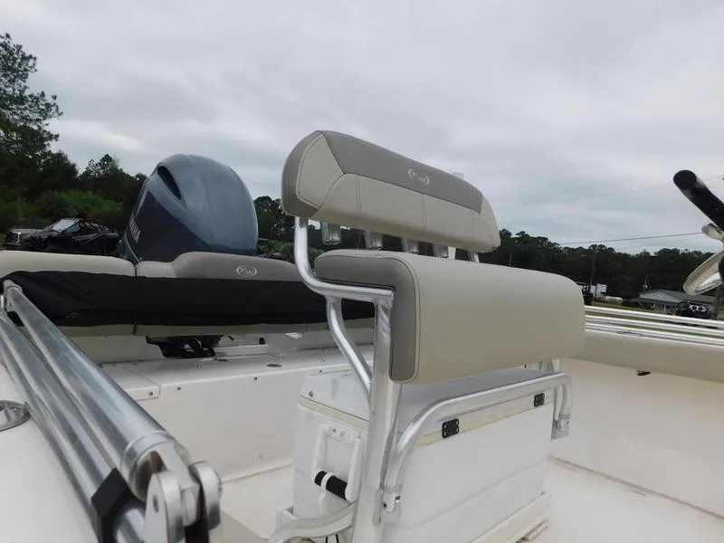Slide: The Image of 2023 Key West 189 FS boat interior with seating and motor. - 7