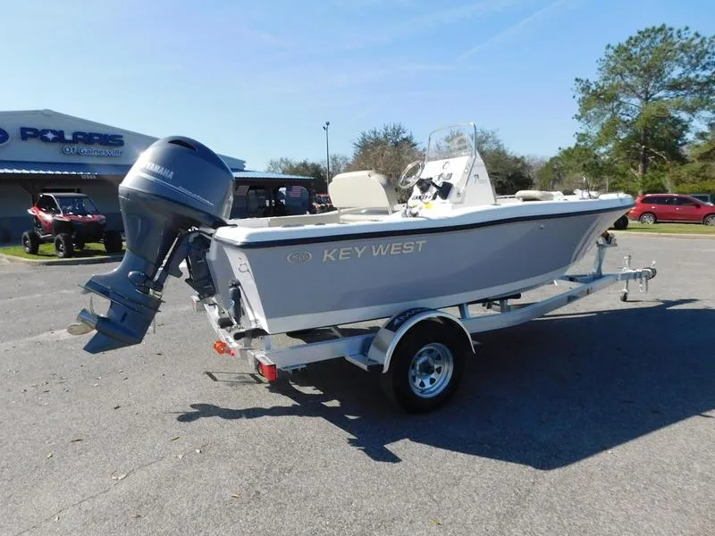 Slide: The Image of 2023 Key West 179FS boat on a trailer, parked outdoors. - 5