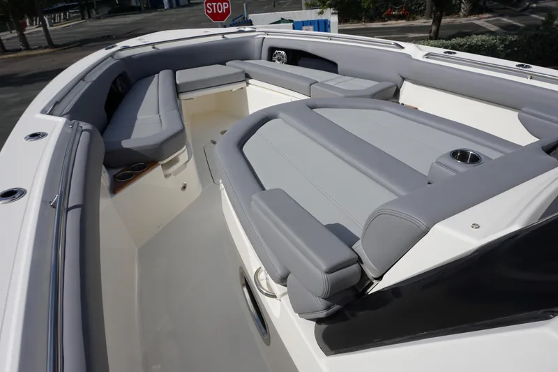 Slide: The Image of 2024 Boston Whaler 360 Outrage boat with spacious seating and modern design. - 22