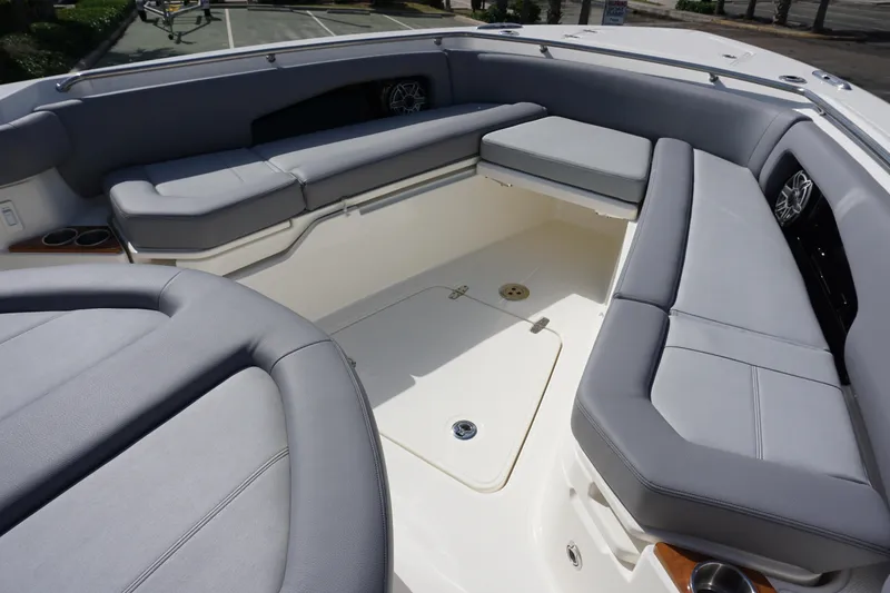 Slide: The Image of 2024 Boston Whaler 360 Outrage boat interior with cushioned seating - 28