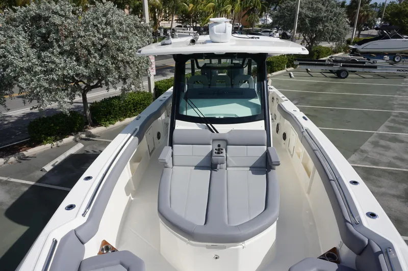 Slide: The Image of 2024 Boston Whaler 360 Outrage boat with spacious seating and modern design. - 30