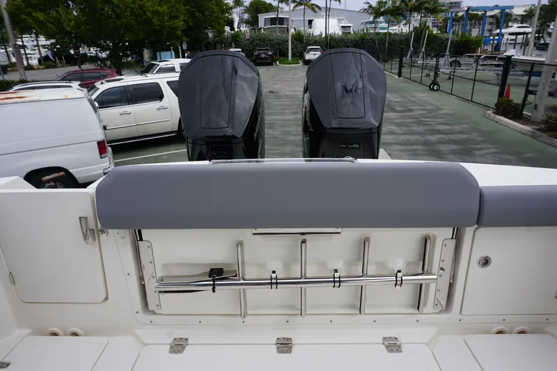 Slide: The Image of 2024 Boston Whaler 360 Outrage boat stern with dual outboard engines. - 34