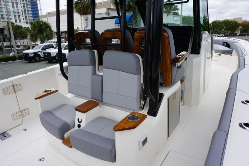 Slide: The Image of 2024 Boston Whaler 360 Outrage boat interior with luxurious seating and modern design. - 39