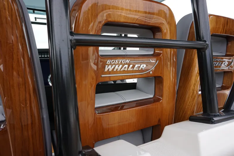 Slide: The Image of 2024 Boston Whaler 360 Outrage boat interior with wooden accents. - 41