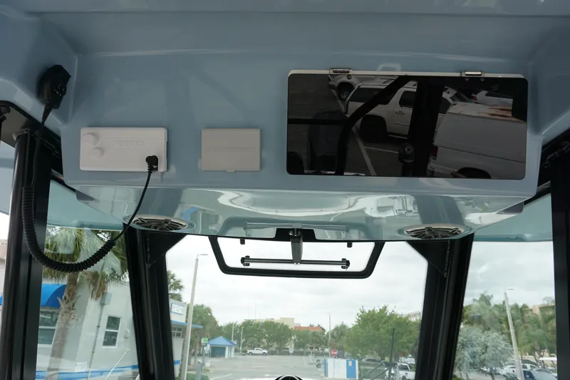 Slide: The Image of 2024 Boston Whaler 360 Outrage helm electronics and overhead console. - 46