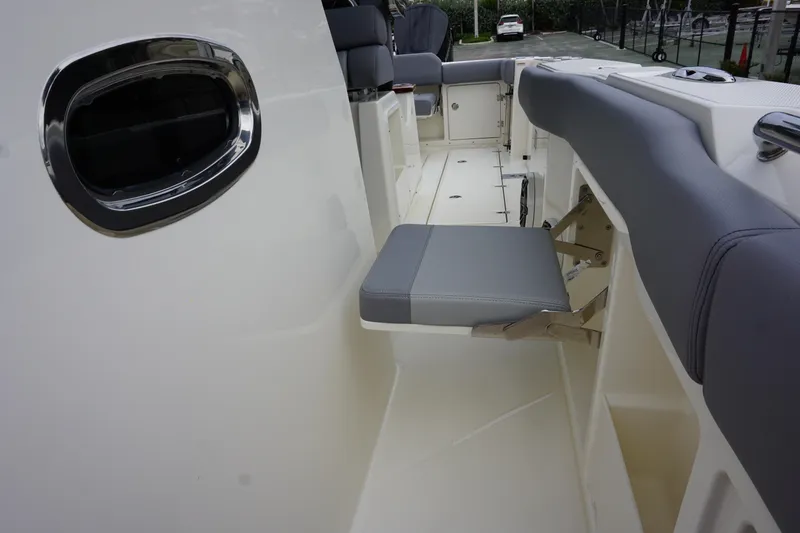 Slide: The Image of 2024 Boston Whaler 360 Outrage interior seating and deck view. - 48