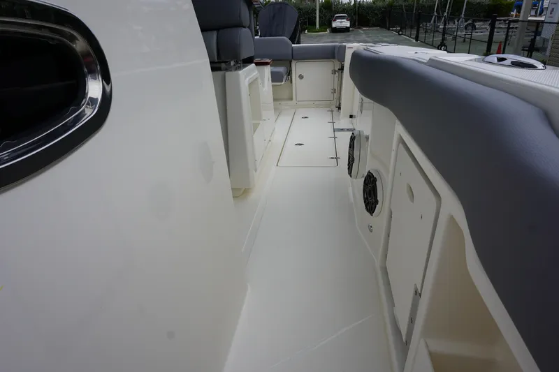Slide: The Image of 2024 Boston Whaler 360 Outrage boat interior, featuring spacious deck and seating. - 49