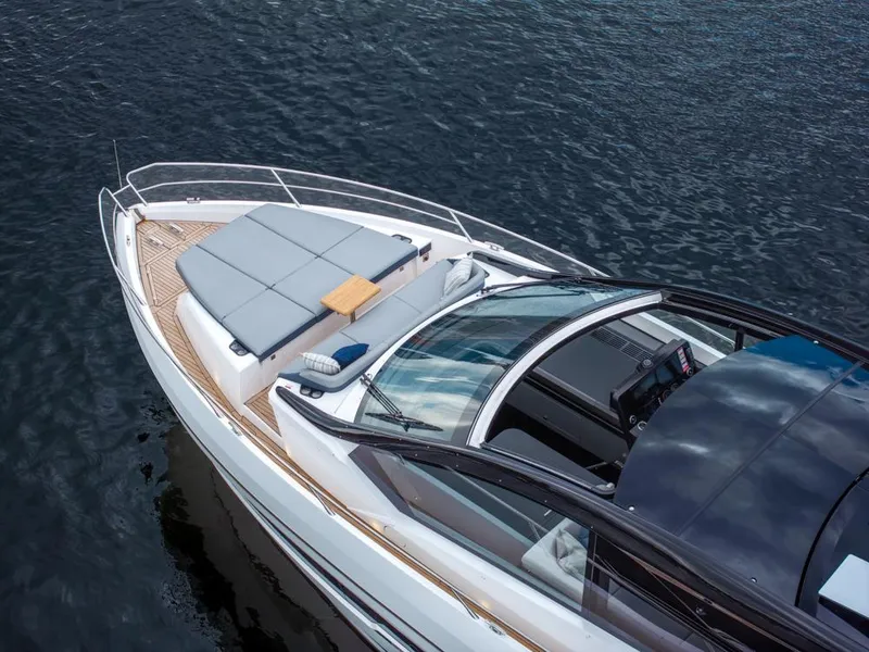 Slide: The Image of Sunseeker Predator 55 yacht, 2025 model, sleek design on calm water. - 2