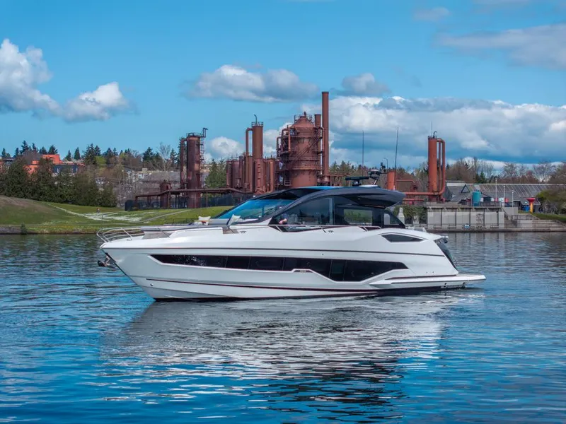 Slide: The Image of 2025 Sunseeker Predator 55 luxury yacht on calm water, showcasing sleek design and modern features. - 24