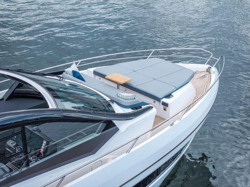 Slide: The Image of 2025 Sunseeker Predator 55 yacht with sleek design and spacious deck on water. - 25