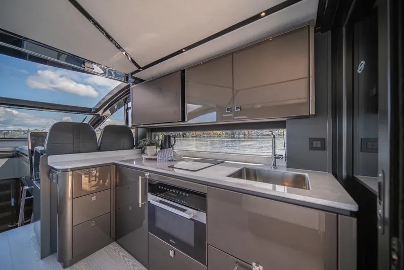 Slide: The Image of Luxurious interior of 2025 Sunseeker Predator 55 yacht with modern kitchen amenities. - 38