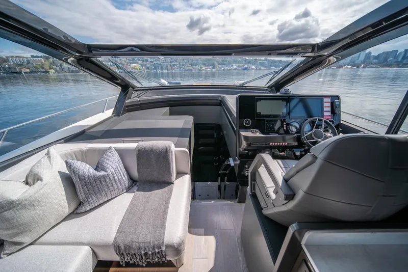 Slide: The Image of Interior of 2025 Sunseeker Predator 55 yacht with modern helm and luxurious seating. - 43