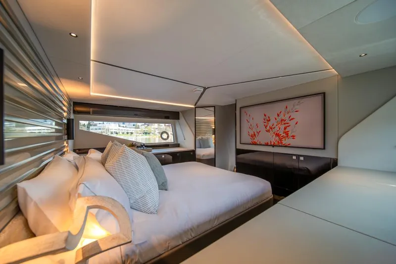 Slide: The Image of Luxurious bedroom interior of 2025 Sunseeker Predator 55 yacht, featuring modern design and elegant decor. - 48
