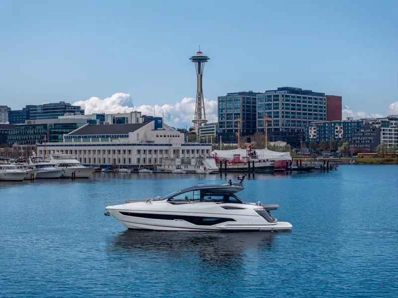 Slide: The Image of 2025 Sunseeker Predator 55 yacht in Seattle harbor with Space Needle in background. - 62