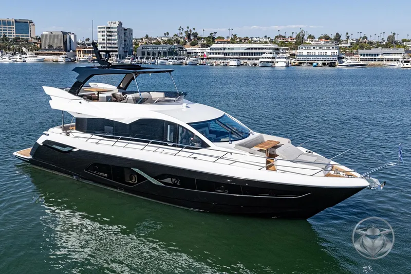 The Image of Luxurious 2025 Sunseeker Manhattan 68 yacht cruising in a scenic marina. - 0