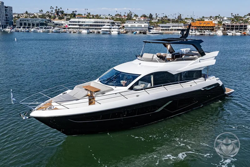 Slide: The Image of 2025 Sunseeker Manhattan 68 luxury yacht cruising in a scenic marina. - 10