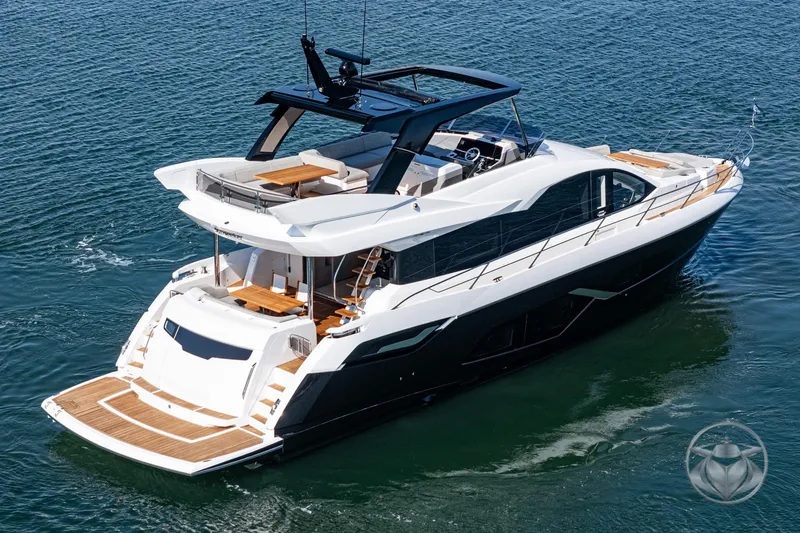 Slide: The Image of 2025 Sunseeker Manhattan 68 luxury yacht cruising on open water. - 16