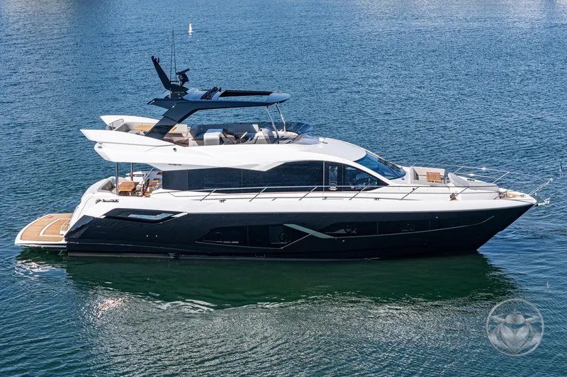 Slide: The Image of 2025 Sunseeker Manhattan 68 yacht on calm water, showcasing sleek design and luxury features. - 19