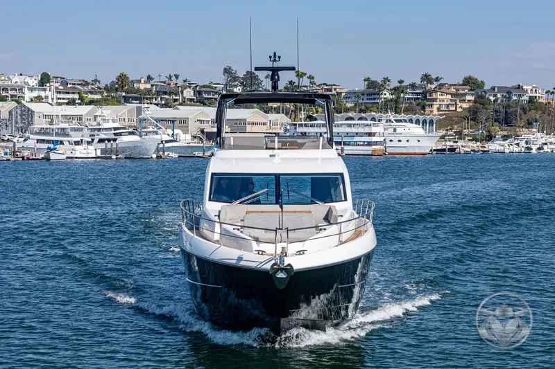 Slide: The Image of 2025 Sunseeker Manhattan 68 yacht cruising in a scenic marina. - 22