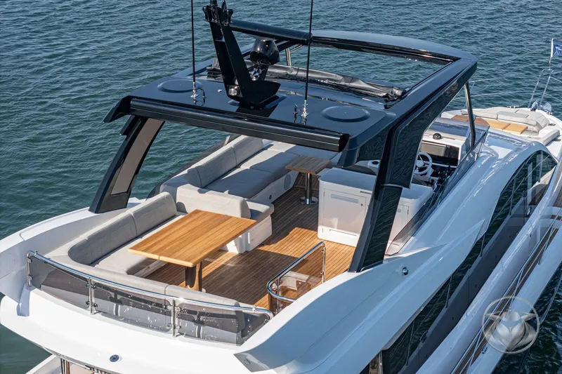 Slide: The Image of Luxurious 2025 Sunseeker Manhattan 68 yacht with spacious deck and modern seating area. - 27