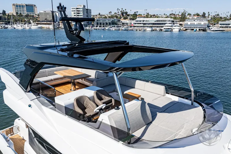 Slide: The Image of 2025 Sunseeker Manhattan 68 luxury yacht on serene water with modern design. - 28