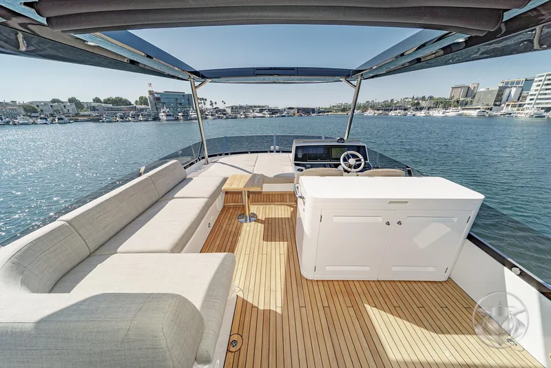 Slide: The Image of 2025 Sunseeker Manhattan 68 yacht interior with seating, helm, and ocean view. - 29