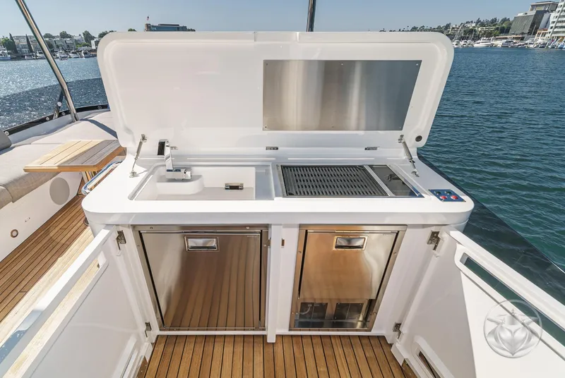 Slide: The Image of 2025 Sunseeker Manhattan 68 yacht outdoor kitchen with grill and sink. - 32