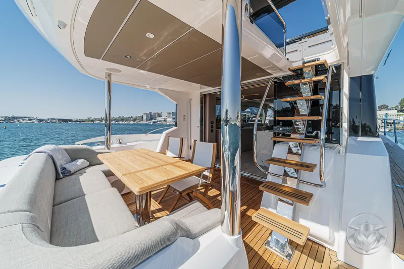 Slide: The Image of Luxurious Sunseeker Manhattan 68 yacht deck with seating and stairs, 2025 model. - 37