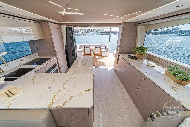 Slide: The Image of Luxurious interior of 2025 Sunseeker Manhattan 68 yacht with modern kitchen and scenic views. - 40