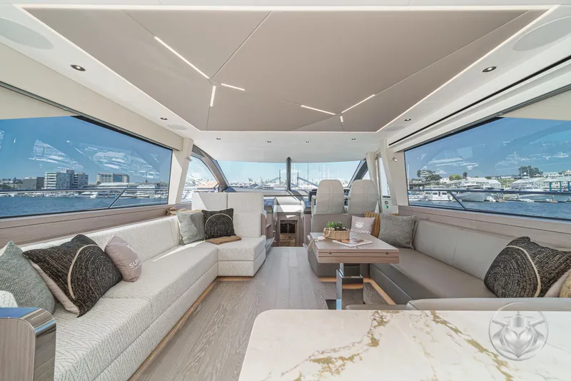 Slide: The Image of Luxurious interior of 2025 Sunseeker Manhattan 68 yacht with elegant seating and panoramic windows. - 44