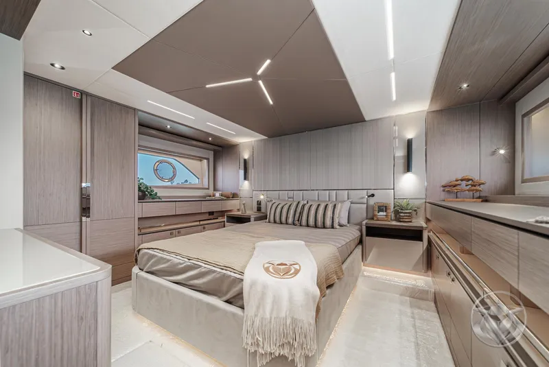 Slide: The Image of Luxurious bedroom interior of 2025 Sunseeker Manhattan 68 yacht, featuring modern design and elegant furnishings. - 7