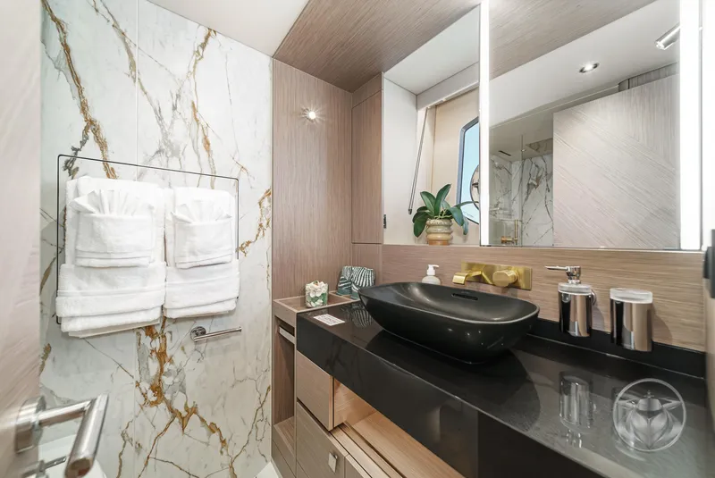 Slide: The Image of Luxurious bathroom in 2025 Sunseeker Manhattan 68 yacht with marble accents and modern fixtures. - 8