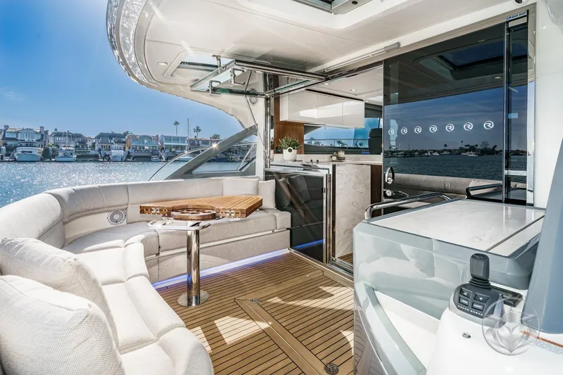 Slide: The Image of Luxurious interior of 2026 Riviera 4600 Sport Yacht Platinum Edition, featuring elegant seating and modern amenities. - 22
