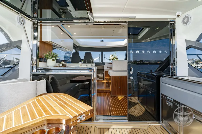 Slide: The Image of Luxurious interior of 2026 Riviera 4600 Sport Yacht Platinum Edition, featuring elegant wood finishes. - 26