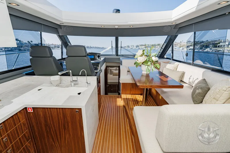 Slide: The Image of Luxurious interior of 2026 Riviera 4600 Sport Yacht Platinum Edition with elegant seating and modern amenities. - 33