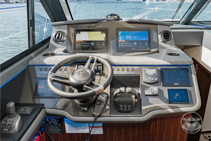 Slide: The Image of Helm of 2026 Riviera 4600 Sport Yacht Platinum Edition with advanced navigation displays. - 40