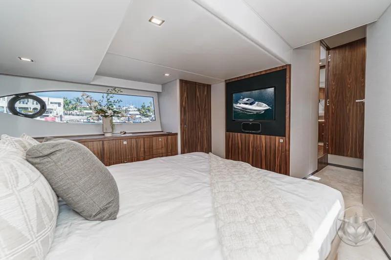 Slide: The Image of Luxurious interior of 2026 Riviera 4600 Sport Yacht Platinum Edition, featuring elegant wood finishes. - 44