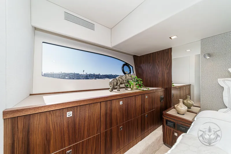 Slide: The Image of Luxurious interior of 2026 Riviera 4600 Sport Yacht Platinum Edition with elegant wood cabinetry. - 45