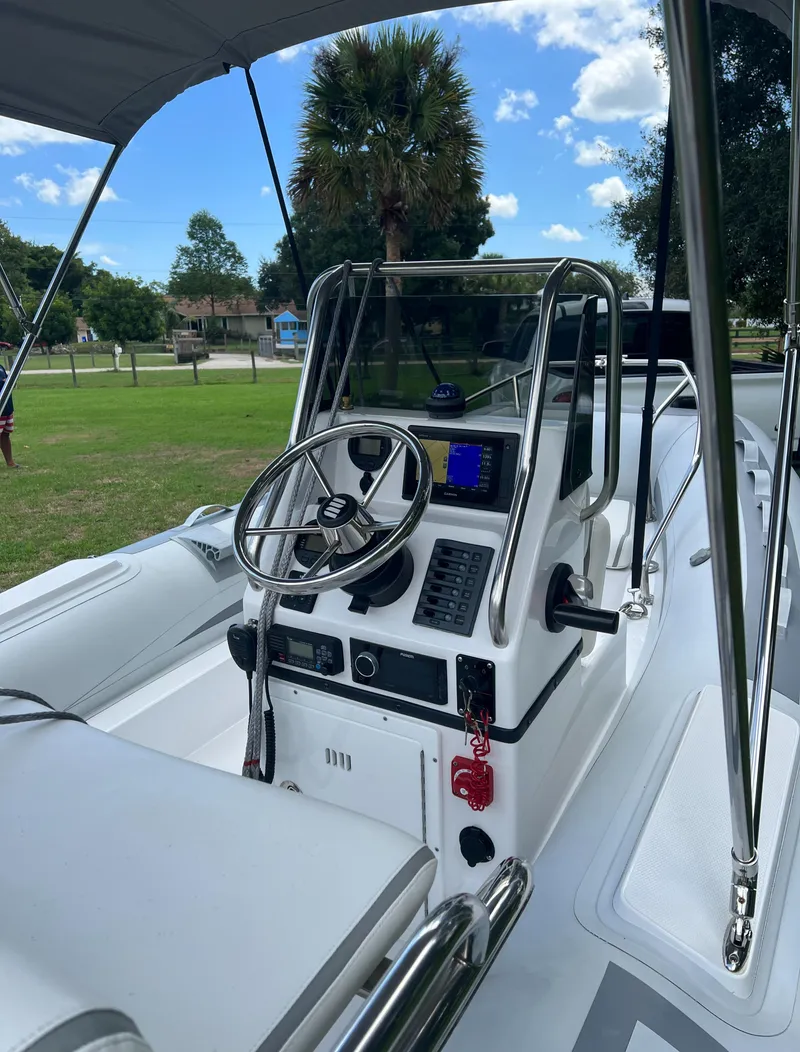 Slide: The Image of 2020 Novurania 460 DL boat interior with steering console and navigation equipment. - 4