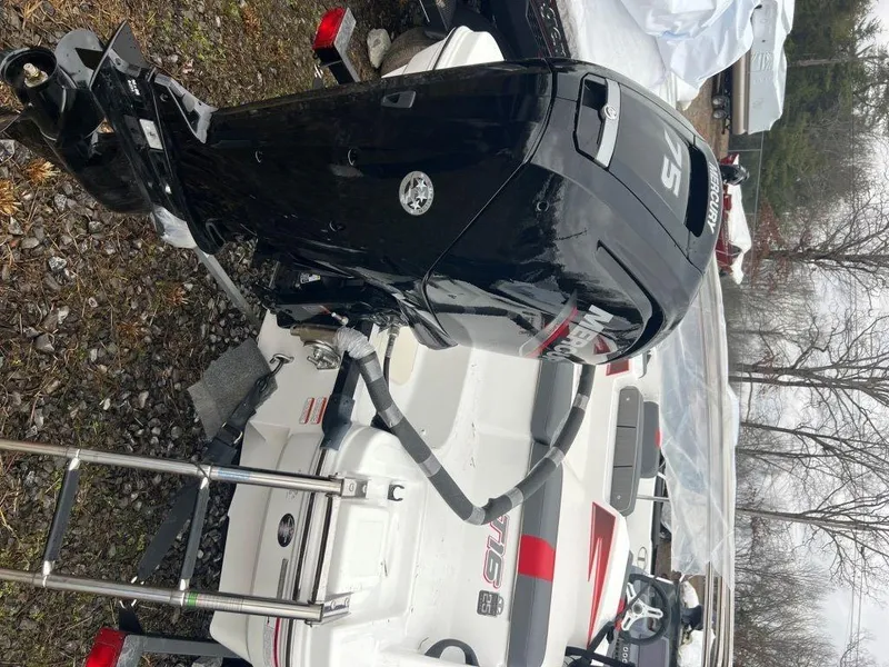 Slide: The Image of 2023 Tahoe T16 boat with outboard motor and ladder. - 2