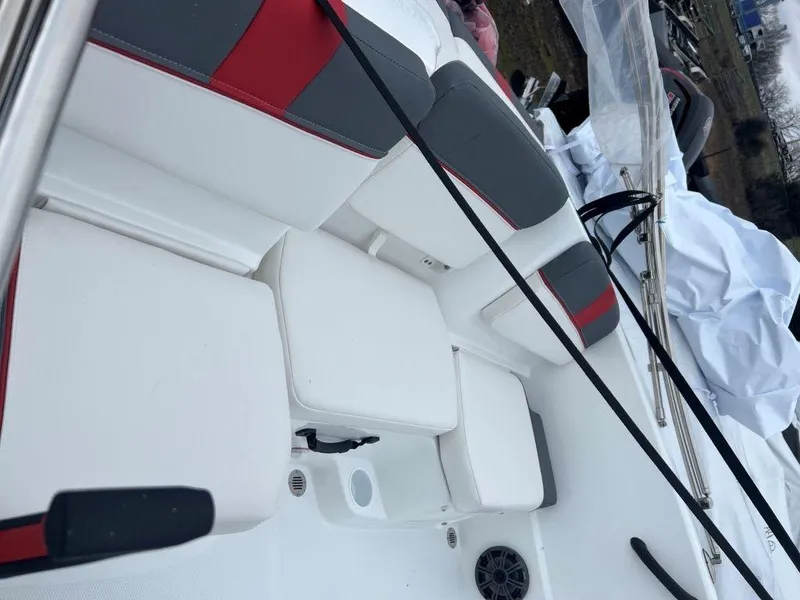 Slide: The Image of 2023 Tahoe T16 boat interior with white and red seating. - 4